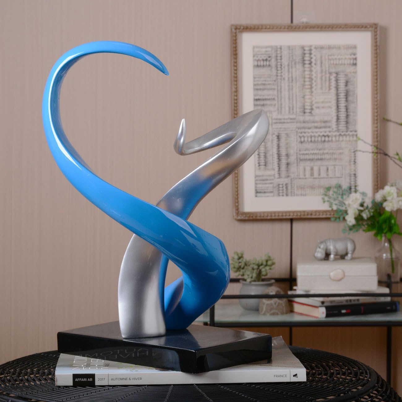Abstract Sculpture of Intertwined Ribbons in Blue and Silver